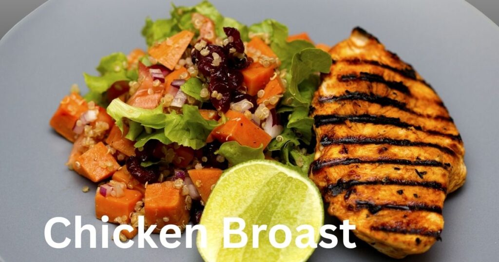 A cooked chicken breast showing white meat with a tender, sliced presentation.